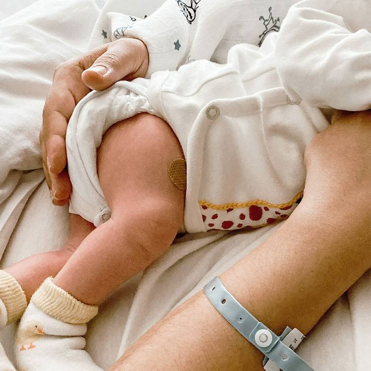 A mother holding her newborn baby