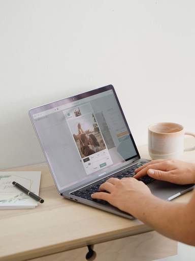 Customer designing her wedding guest book on a laptop