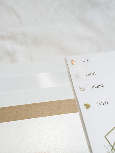 Pocketfold showing different premium paper types for wedding place cards