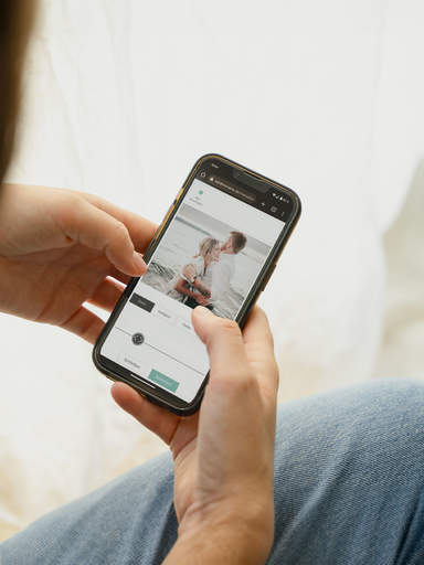 Woman using the sendmoments digital photo album service for her wedding menu cards