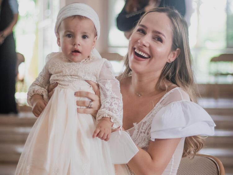 A baby dressed for a christening