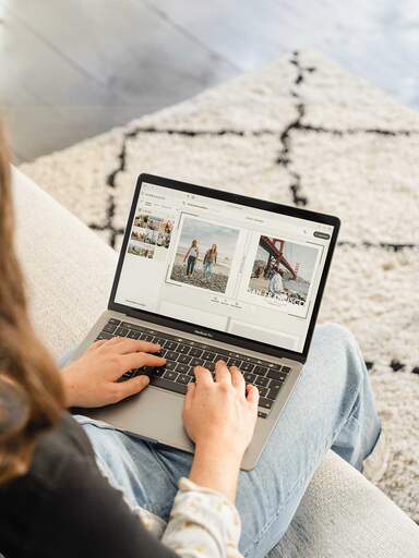 Woman designing her holiday photo book online